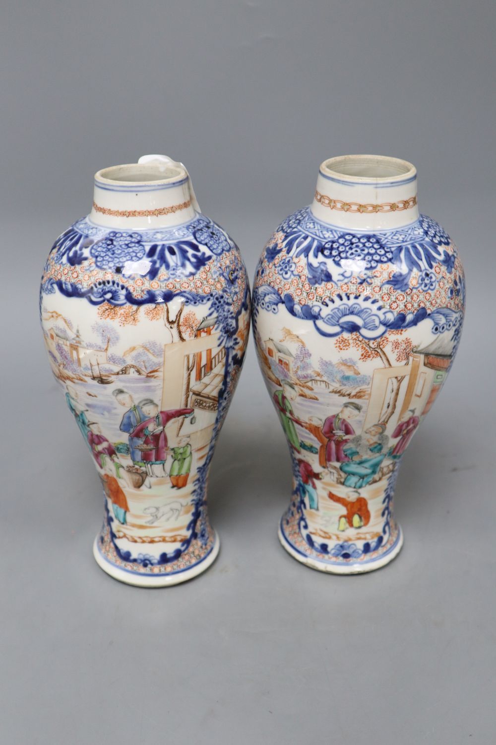 A pair of 18th century Chinese famille rose figural vases, height 25.5cm